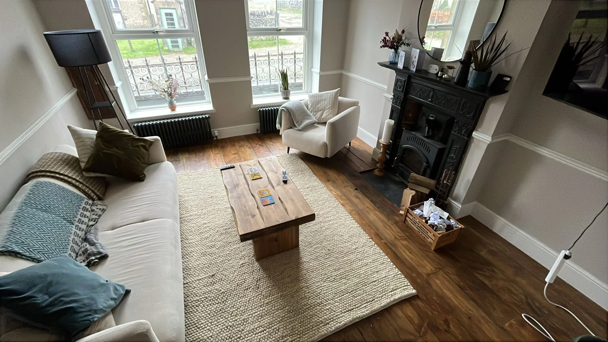 room with wood flooring and rug