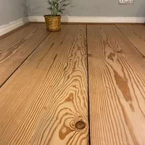pitch pine flooring with plant